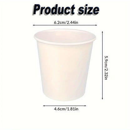 Small disposable paper cup with labeled dimensions in centimeters and inches.