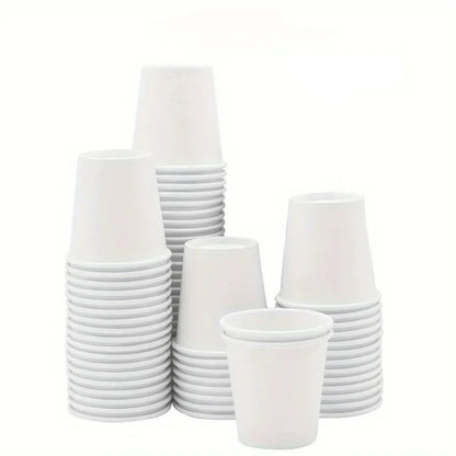 Neatly stacked disposable white paper cups labeled as 50PCS.
