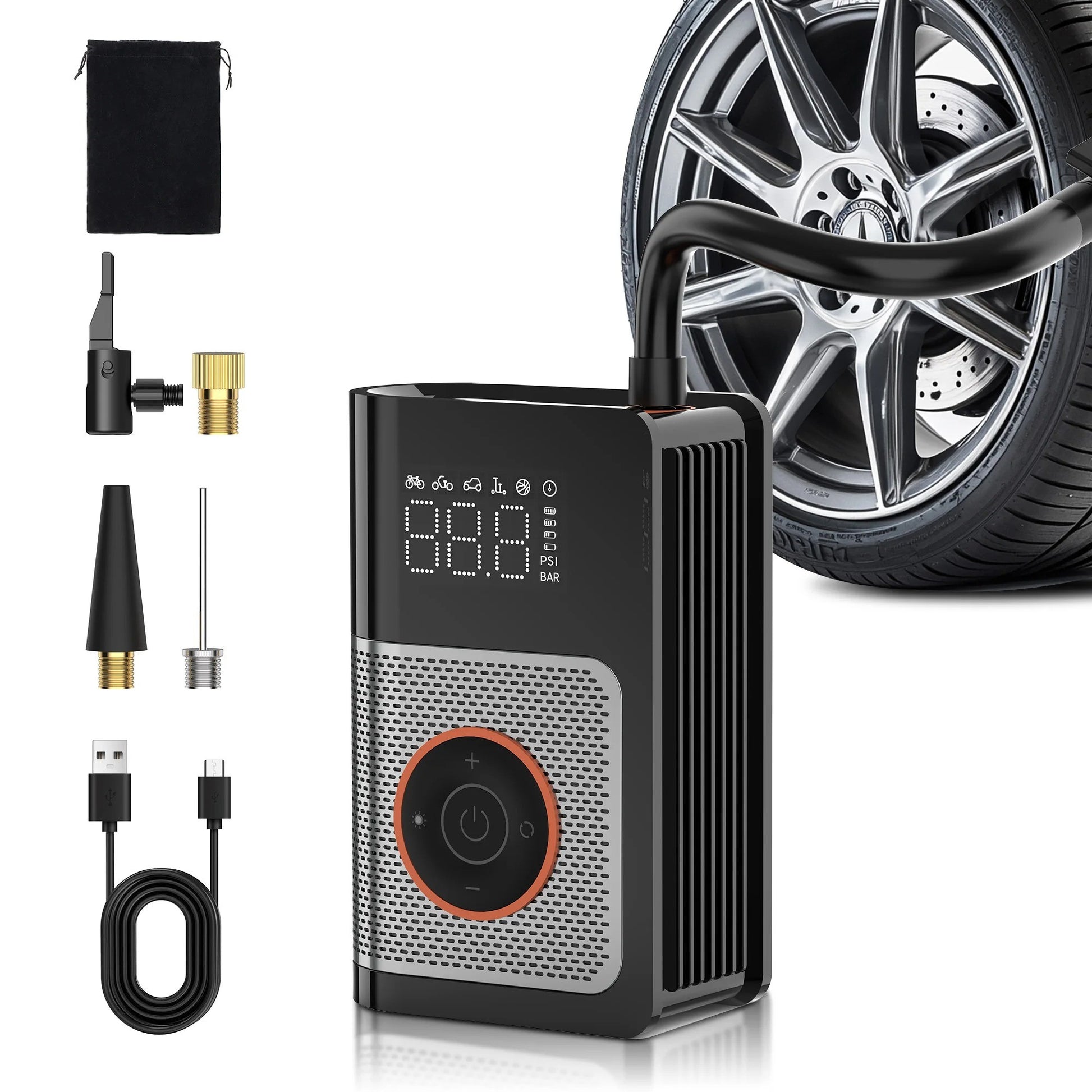 Tire inflator with attachments next to a car wheel