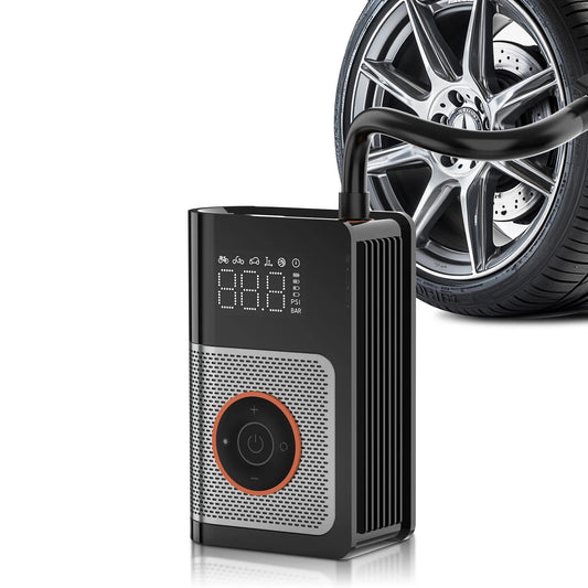 Tire inflator with attachments next to a car wheel