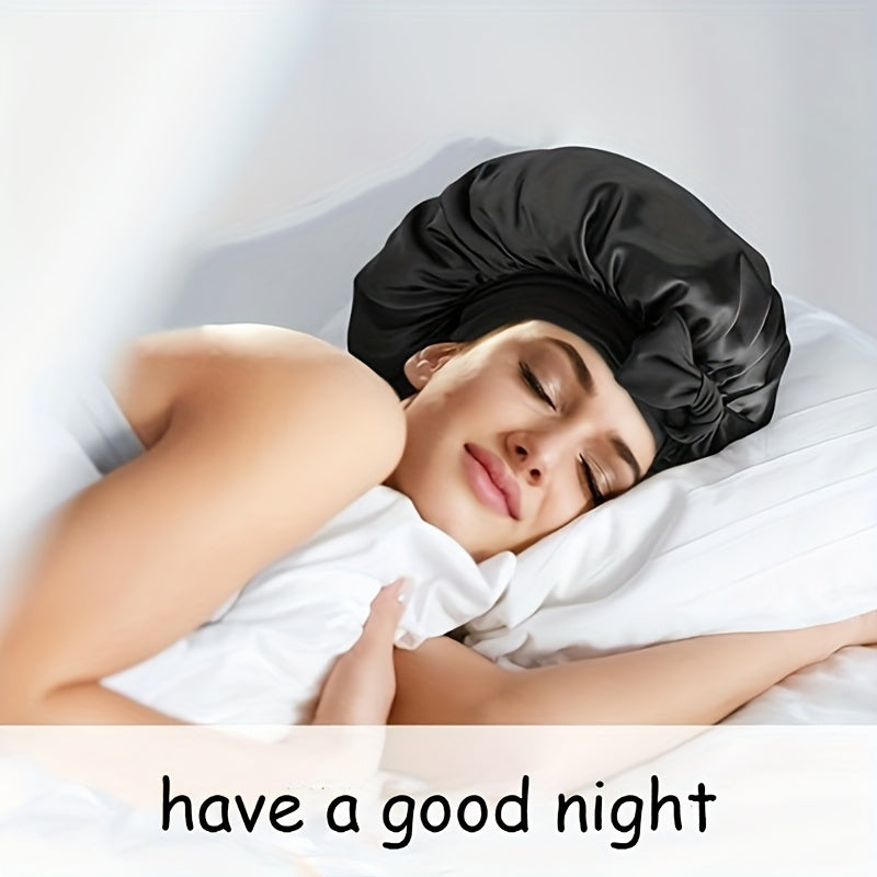 Woman sleeping peacefully while wearing black satin bonnet on white bed