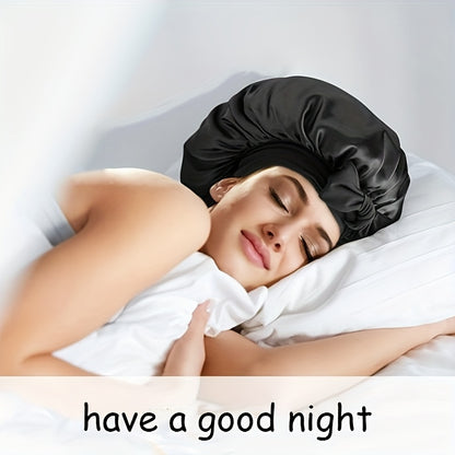 Woman sleeping peacefully while wearing black satin bonnet on white bed